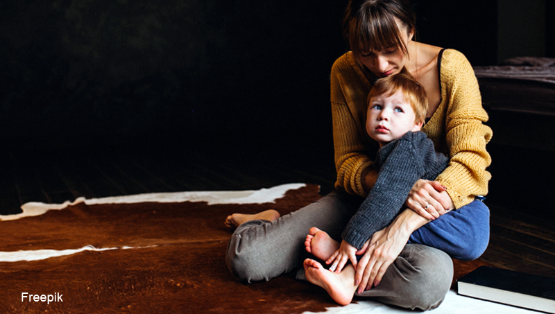 Mother with her son playing in the room
